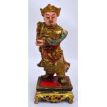 An early 20th century gilded and painted figure of Guan Yu on pierced square section base,