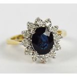 A 9ct yellow gold sapphire and diamond floral set ring,