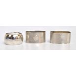 A pair of George VI hallmarked silver oval napkin rings with overall engine turned decoration