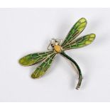 A white metal plique-á-jour enamel decorated dragonfly brooch, length 5cm, wingspan 6.
