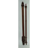 Two similar wooden curtain poles with turned terminals, the larger length 160cm (2).