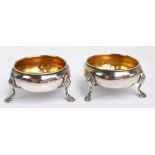 A pair of George III hallmarked silver small circular salts with gilt washed interiors and each