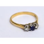 An 18ct yellow gold diamond and sapphire three stone ring,