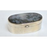 A late 19th century Colonial white metal box of plain oval form with polished moss agate hinged lid,