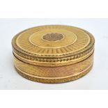 A 19th century French gilt metal box with overall engine turned decoration centred with a floral