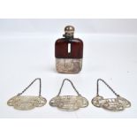 A set of three George V hallmarked silver bottle labels for "Gin", "French Vermouth",