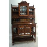 A late Victorian Arts and Crafts walnut display cabinet,