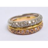 BOODLE & DUNTHORNE; an 18ct two tone gold half eternity ring,