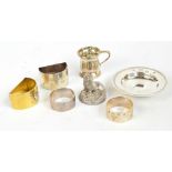 A small group of silver comprising an Elizabeth II hallmarked silver gilt D shaped napkin ring with