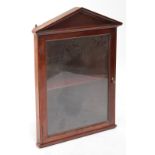 A 20th century mahogany wall mounted corner display cabinet with plain pediment,