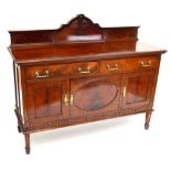 An early 20th century mahogany sideboard with two drawers and three cupboard doors raised on square