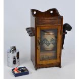 A quantity of smoking related items comprising a small smoker's cabinet with external pipe rack,