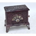 A late 19th century French purple cast iron "Pied-Selle" stove, width 54cm.