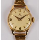 OMEGA; a lady's vintage 9ct gold wristwatch with circular dial and pierced bracelet,