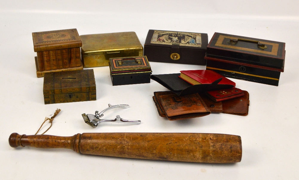 A walnut jewellery box modelled as books with inlaid hinged lid, three vintage tin money boxes,