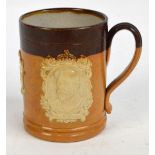 A Royal Doulton stoneware mug commemorating George V and Queen Mary inscribed "From Sir Robert