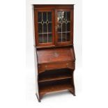 An early 20th century oak bureau bookcase,