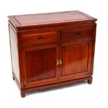 A Chinese hardwood cabinet with two drawers above two cupboard doors.