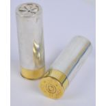 A novelty pair of Elizabeth II hallmarked silver and brass capped cruets in the form of shotgun