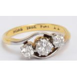 An 18ct yellow gold and diamond three stone graduated ring, the central diamond approx 0.