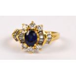 An 18ct yellow gold diamond and sapphire ring,