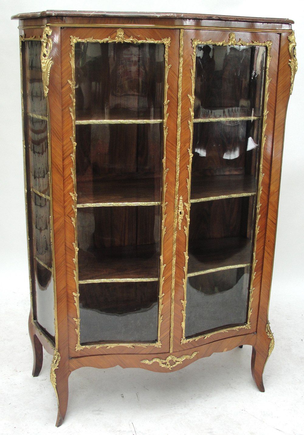 A late 19th/early 20th century French kingwood and gilt metal mounted vitrine in the Louis XV style,