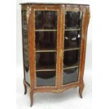 A late 19th/early 20th century French kingwood and gilt metal mounted vitrine in the Louis XV style,