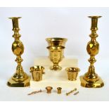 A small collection of brassware comprising a pair of large candlesticks,