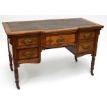 A late Victorian oak and pollard oak breakfront kneehole desk with leather inset top above central