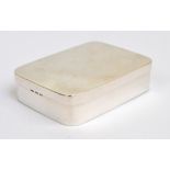 A George V hallmarked silver snuff box of plain rounded rectangular form, with gilt wash interior,