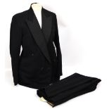 A vintage black suit with matching trousers, width of shoulders 46cm, and a black tailcoat,