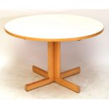 A 1970's Gordon Russell circular dining table designed by Martin Hall,
