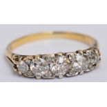 An 18ct yellow gold diamond graduated five stone ring, the central stone approx 0.