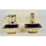 A pair of Edward VII hallmarked silver open salts of rounded rectangular form with gadrooned and