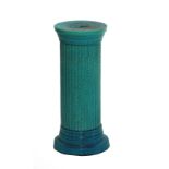 A Burmantofts turquoise glazed jardinière stand of circular form, impressed marks to base and no.