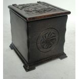 A carved oak coal/slipper box, the top decorated with a galleon.