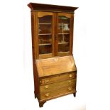 An Edwardian oak bureau bookcase,