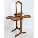 An early 20th century oak "Monoplane" cake stand.