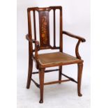 An Edwardian mahogany and inlaid elbow chair raised on cabriole front legs.
