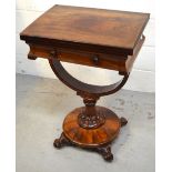 A Victorian rosewood games/work table with fold over top and single drawer on unusually shaped