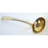 An George III hallmarked silver sauce ladle with engraved stag's mask and antler decoration to the