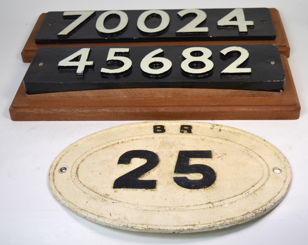 Three railway signs, a bridge plate marked 'BR25',