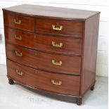 An early 19th century mahogany bow-fronted campaign chest of drawers,