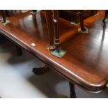 An early Victorian mahogany breakfast table of rounded rectangular form,