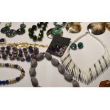 A large quantity of costume jewellery to include necklaces, Buckingham jewellery,