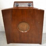 A vintage Murphy free standing radio, height 83cm.