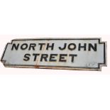 A cast iron street sign 'North John Street', length 104cm.