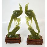 A pair of naturalistic modelled carved jade peacocks, unsigned,