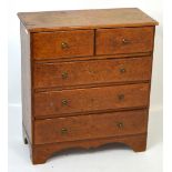 A miniature two-over-three chest of drawers on shaped plinth base, height 38cm.