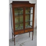 An Edwardian mahogany inlaid display cabinet, two astragal glazed doors,